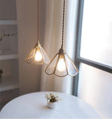 Brass pendant lamp fluted glass shade close-up