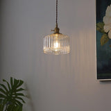 Brass pendant light side angle detail view