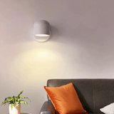 Adjustable metal wall lamp warm glow in hallway