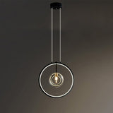Glass pendant light above kitchen counter
