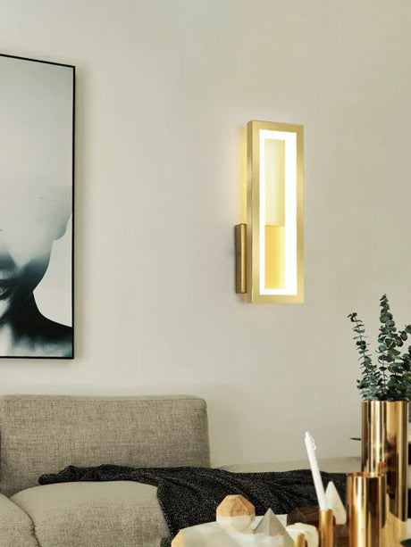 Gold finish wall light in a living room