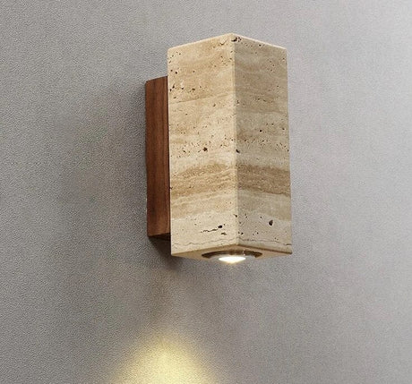 Travertine-inspired finish detail on sconce