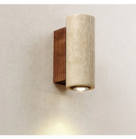 Wall sconce mounted along a staircase