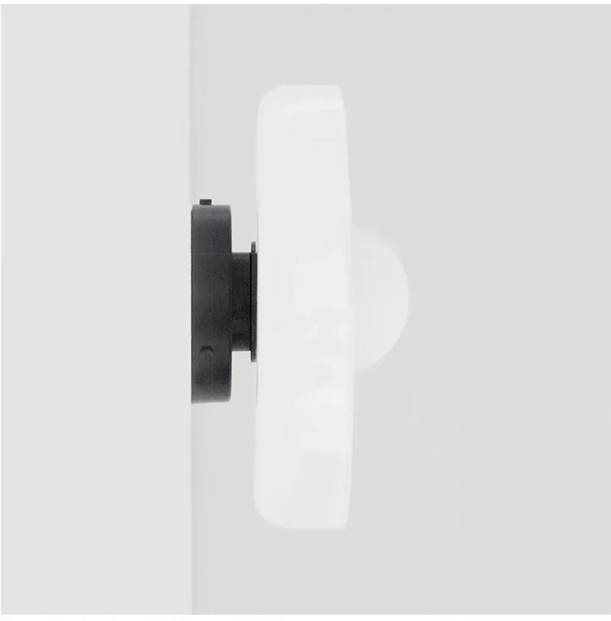 Wall lamp mounted in hallway setting