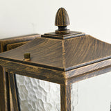 Close view of the pointed roof and finial in the antique bronze finish