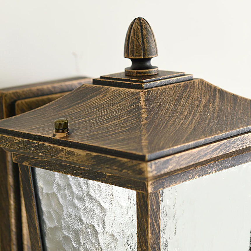 Close view of the pointed roof and finial in the antique bronze finish