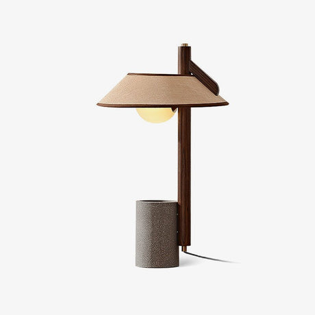 Cement base lamp seen from an angle with the shade cantilevered out