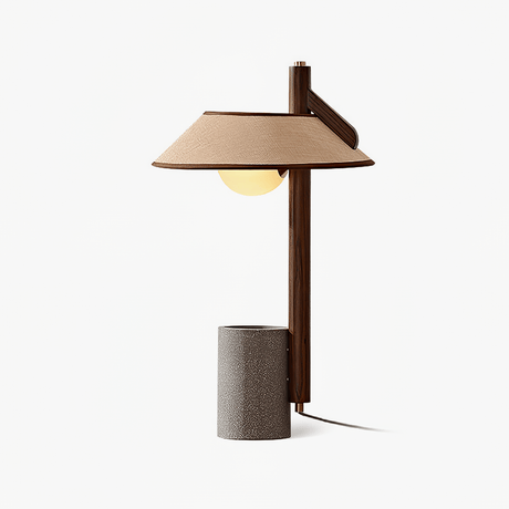 Table lamp with a flat wood post on a cement cylinder and a wide shade