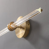 Close view of the joint where the glass rod passes through the round plate