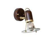 The fitting in profile, the barrel tipped down off its short brass arm