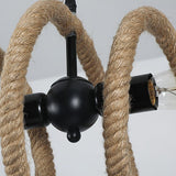 The black iron joint where the two lamp holders meet the rope core
