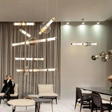 Two linear bars lit at different heights in a wide open room