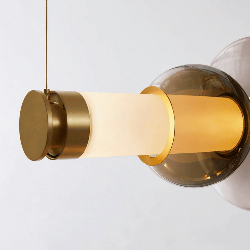 Close view of the smoked glass disc threaded onto the lit acrylic tube