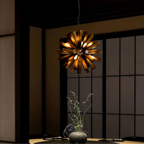 Chandelier lit above a dining table beside a shoji screen window