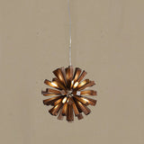The walnut tone version lit, light escaping between the angled slats
