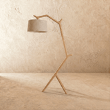The light wood frame with a gray drum shade held forward on the leaning post