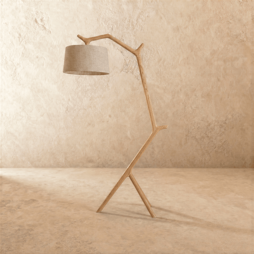 The light wood frame with a gray drum shade held forward on the leaning post