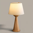 Japandi table lamp with the natural wood hourglass base, front view