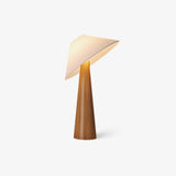 Tilted shade table lamp in natural wood seen from a slight angle