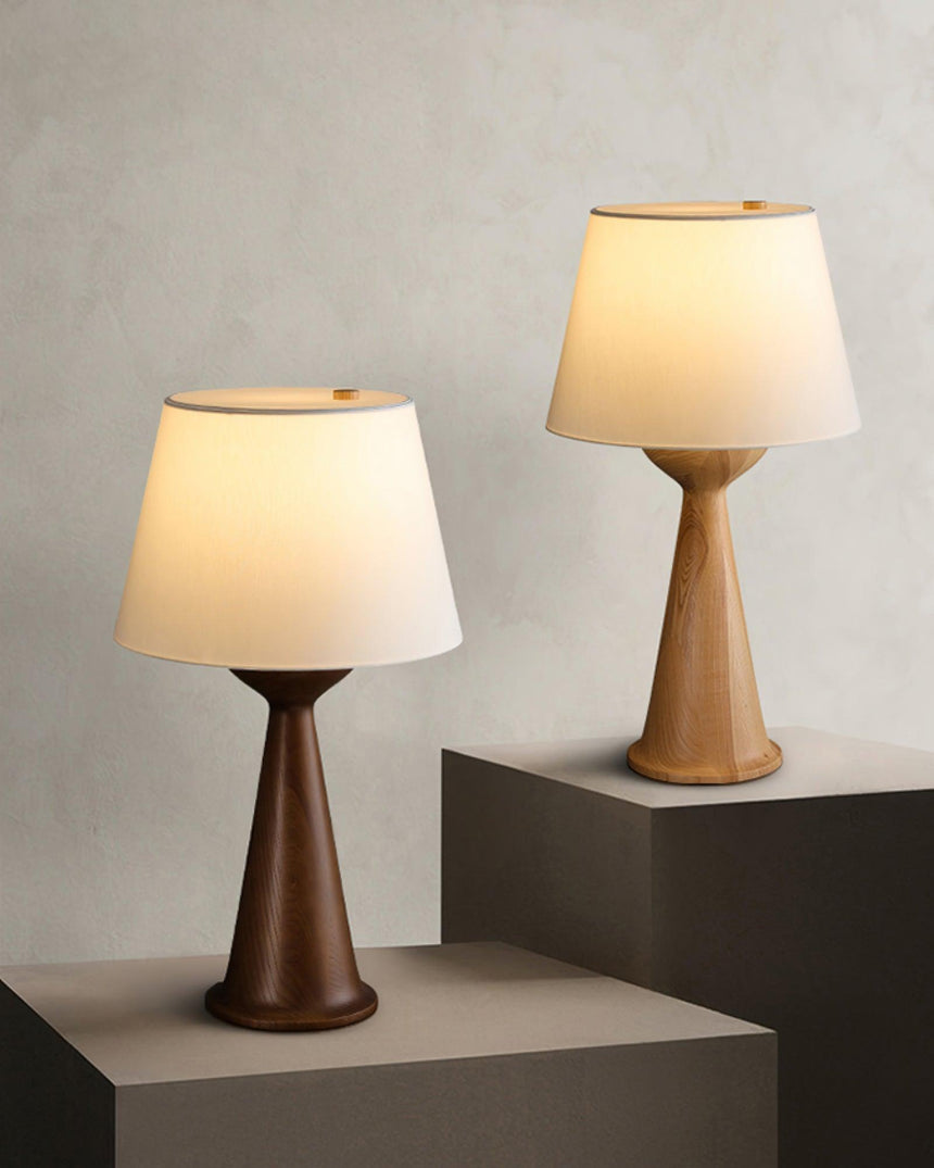 The two sizes of the Japandi table lamp standing side by side on plinths
