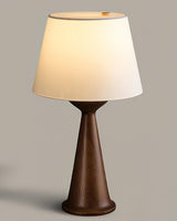 Japandi table lamp with the walnut hourglass base seen from the front