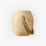 Japandi wall lamp shaped like a small travertine urn with a thick hemp rope looped across it