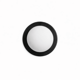 The black ring unlit, the frosted ball matte against the dark frame