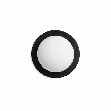 The black ring unlit, the frosted ball matte against the dark frame