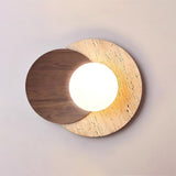 Walnut disc over a travertine disc with the white orb lit between them