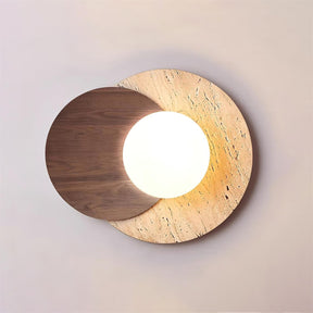 Walnut disc over a travertine disc with the white orb lit between them
