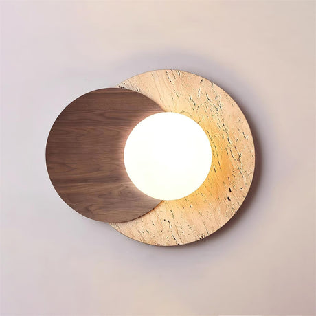 Walnut disc over a travertine disc with the white orb lit between them