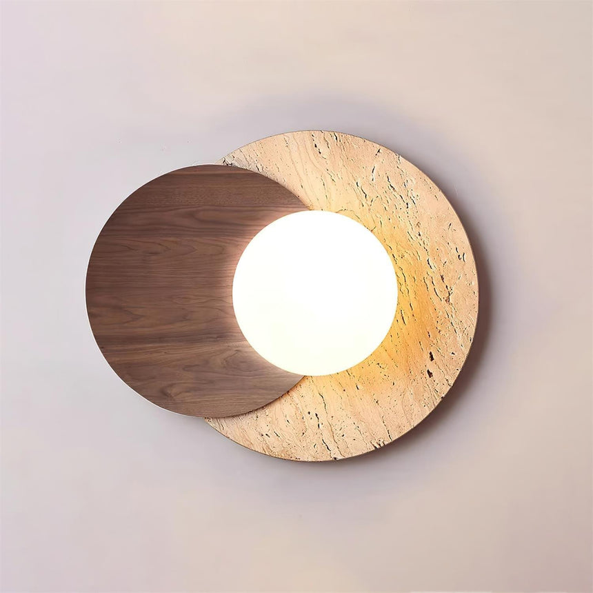Walnut disc over a travertine disc with the white orb lit between them