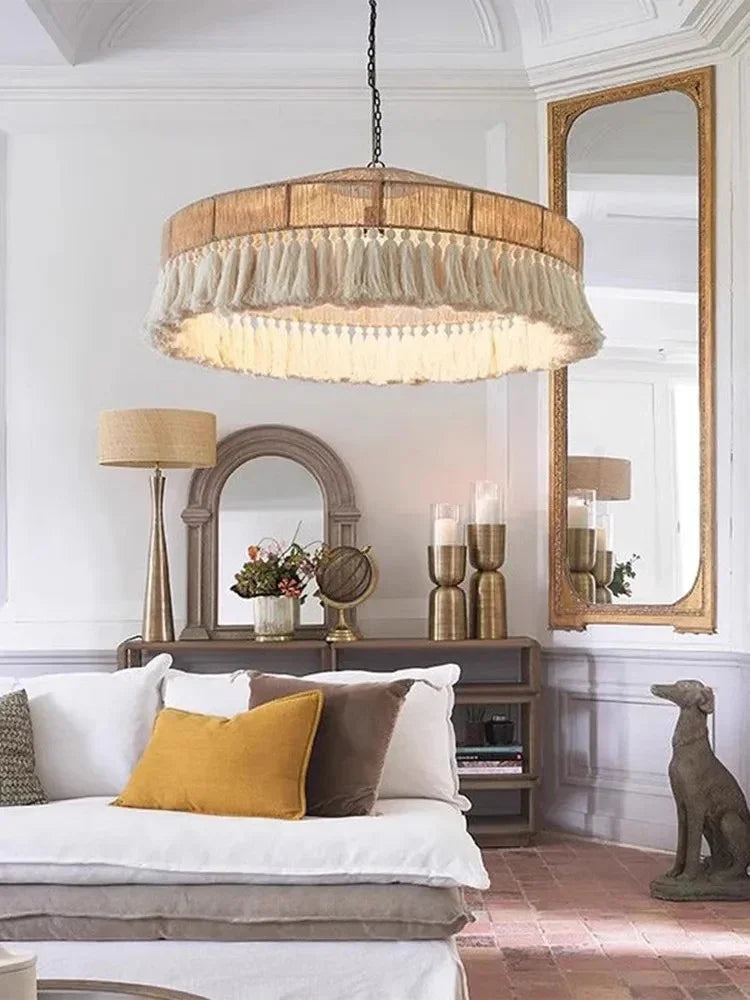 Jute pendant light above a bed in a warm toned bedroom