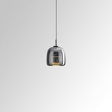 Tinted glass pendant light for compact spaces