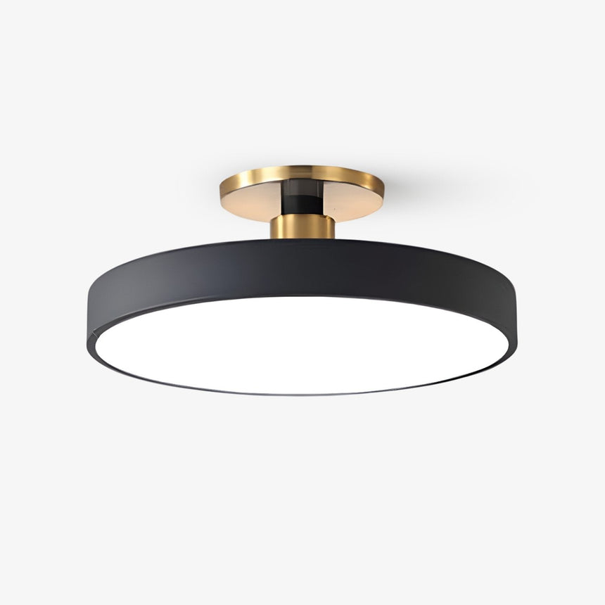 Kitchen flush mount ceiling light with a black metal drum and a brass stem