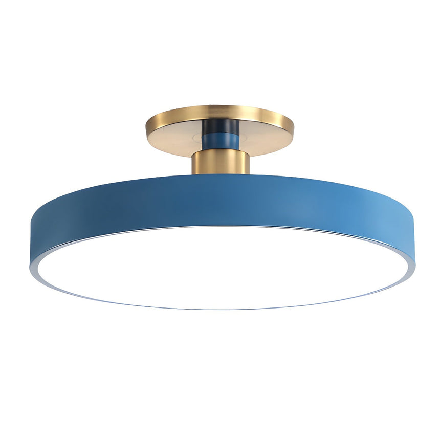Blue drum ceiling light with a brass stem seen at an angle