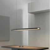 The lit bar hung above a dark counter under a plain ceiling