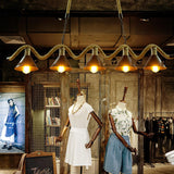 The fitting lit above a display rail and a shelf of folded goods