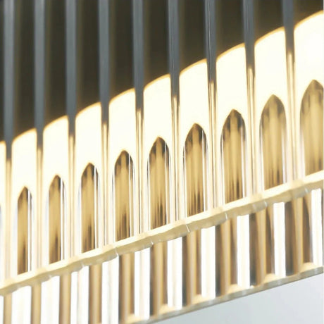 Close view of the ribbed acrylic face glowing along the metal bar