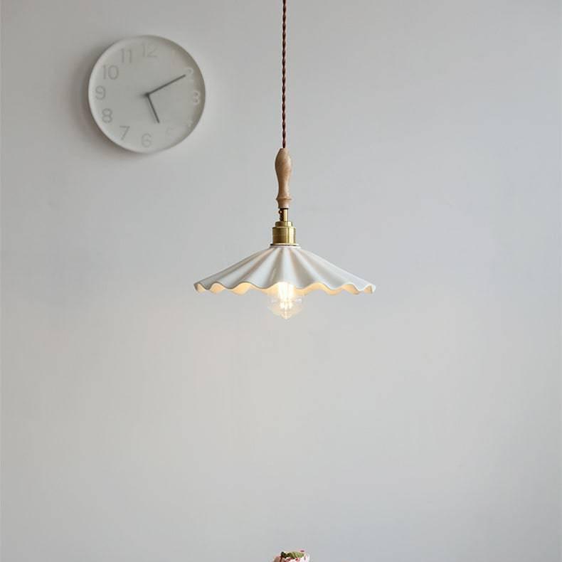 Ceramic pendant light above kitchen island