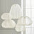 Cluster of five white fabric lanterns at staggered heights