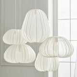 Cluster of five white fabric lanterns at staggered heights