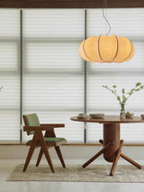 Ribbed silk lantern above a round dining table