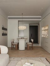 Ribbed silk lantern hung in a pale empty room