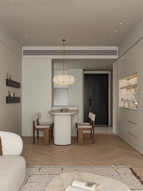 Ribbed silk lantern hung in a pale empty room