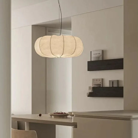 Ribbed silk lantern in a room with dark shelves