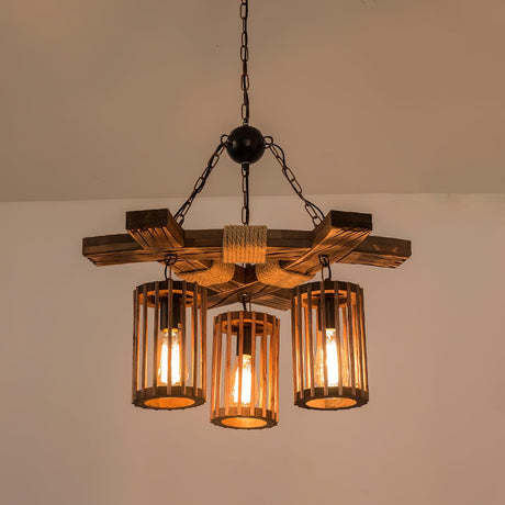 The chandelier lit in a plain pale room, slats and beams in view