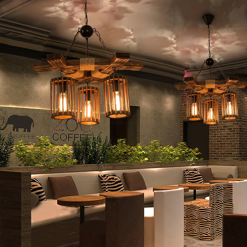 The lanterns lit above a banquette with a planted trough beside it