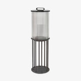 Fluted glass lantern with black bands and a tall four leg floor stand