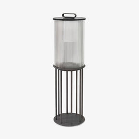 Fluted glass lantern with black bands and a tall four leg floor stand